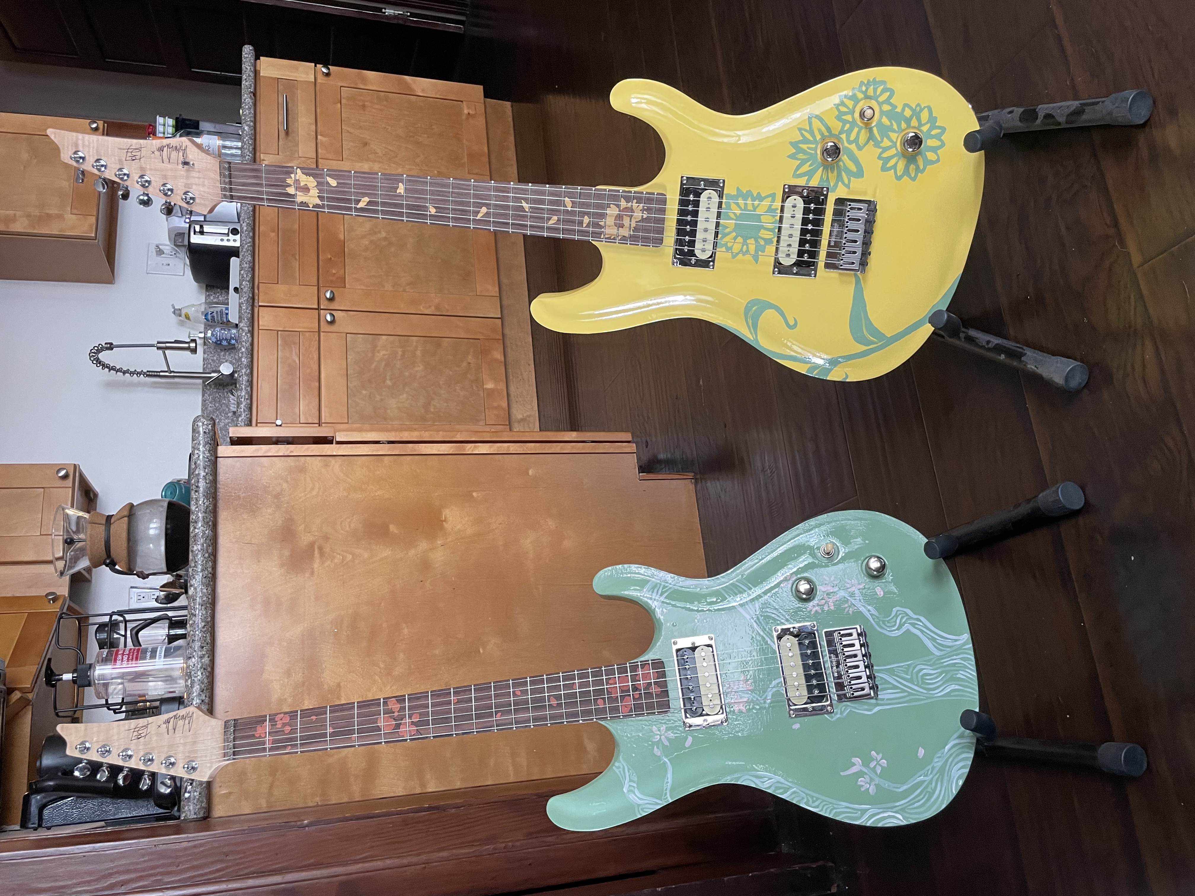 Front of guitars <br> Wood and acrylic <br> Crafted by Andrew Aubertin. Artwork by Erika Novitsky
