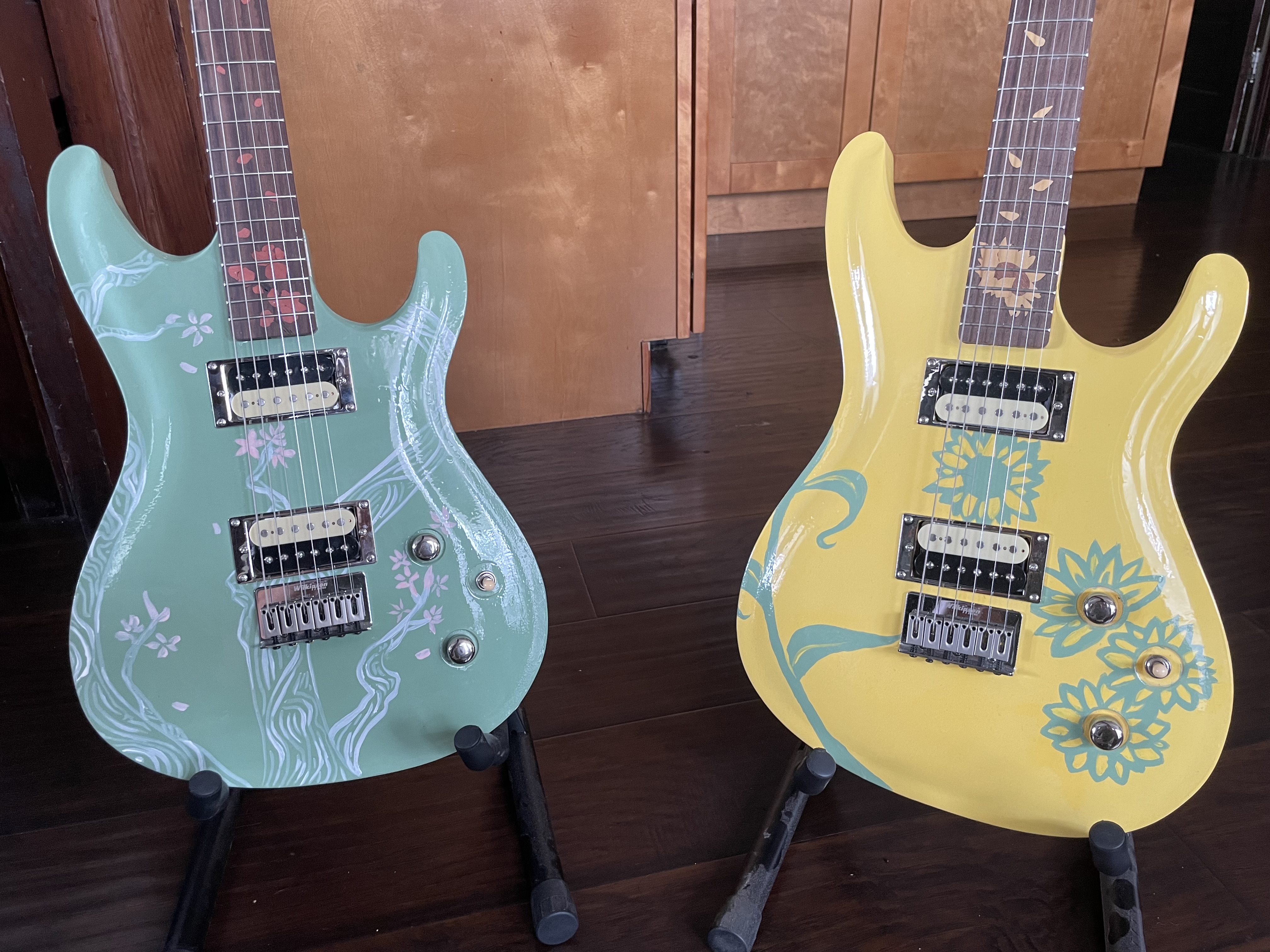 Front of guitars <br> Wood and acrylic <br> Crafted by Andrew Aubertin. Artwork by Erika Novitsky