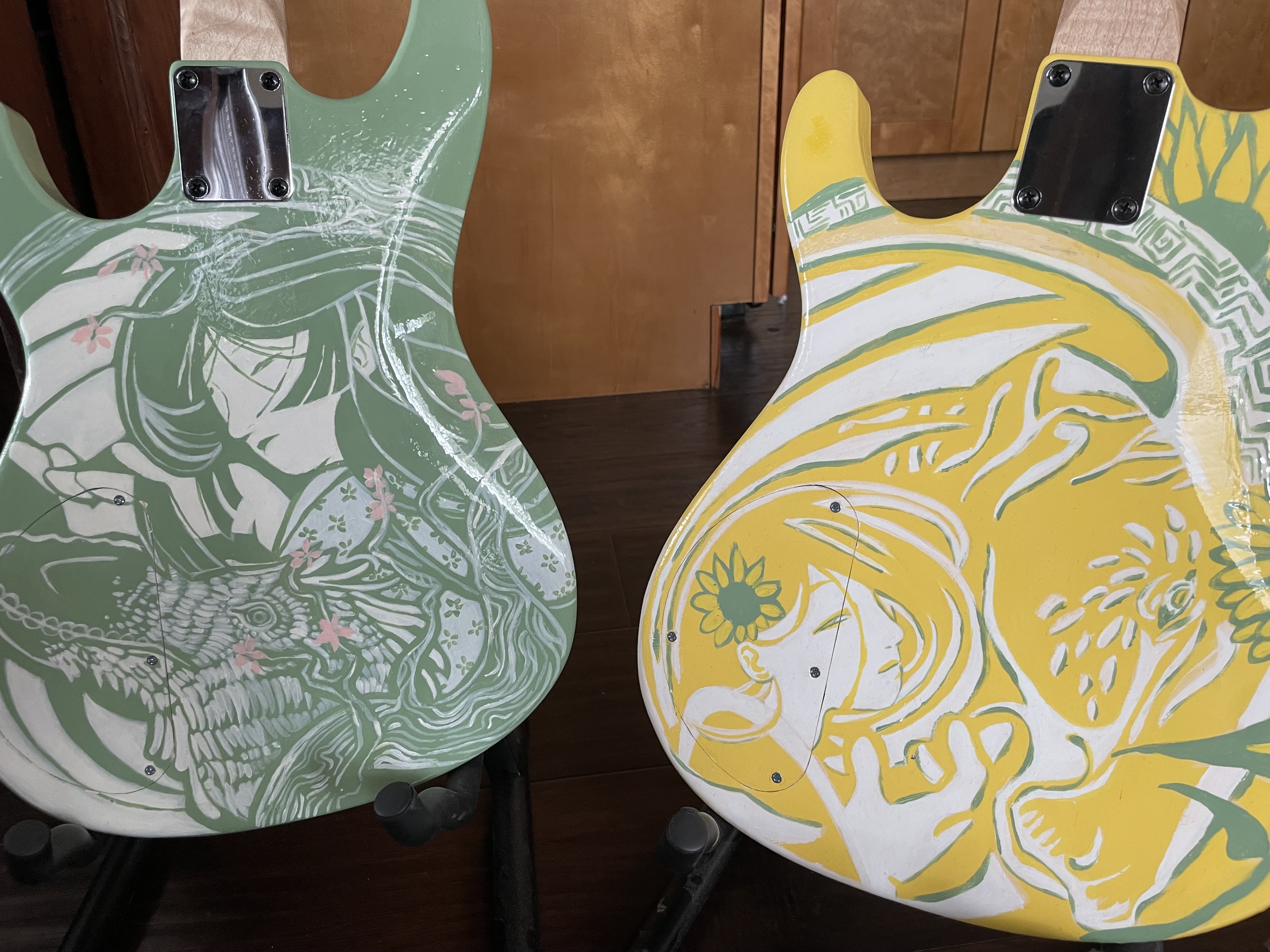 Back of guitars <br> Wood and acrylic <br> Crafted by Andrew Aubertin. Artwork by Erika Novitsky